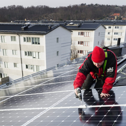 Man constructing solar panels
