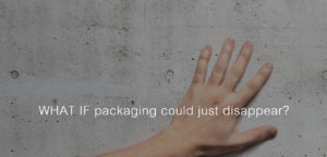 Hand on wall with text "what if packaging could just disappear?"