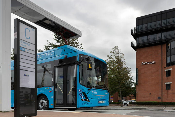 Electric bus being charged at depot