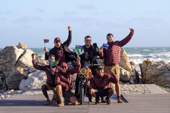 Crew standing together with the Roam air electric motorcycle