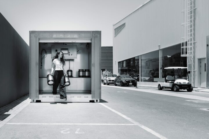 A person standing in front of the micro-factory